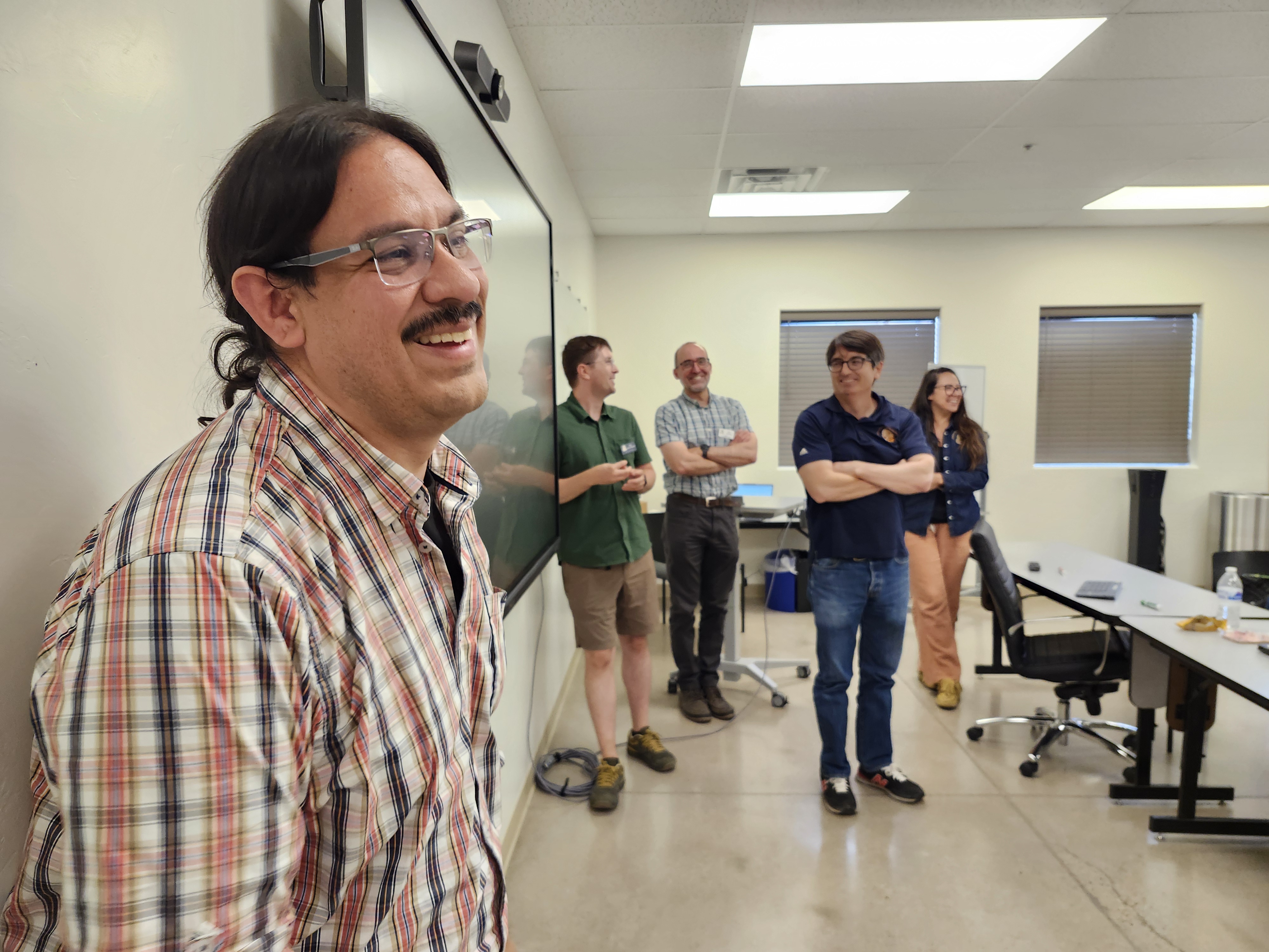 Rolando Coto leads the ASR for language work workshop at O'odham Ñi'okǐ Ki:, June 2025